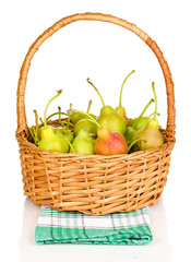 ripe pears in basket isolated on white.