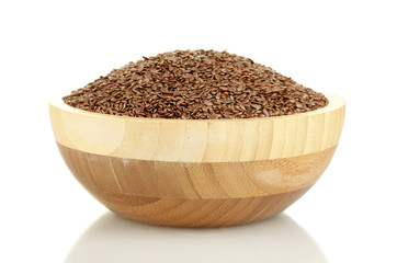 flax seeds in wooden bowl isolated on white background