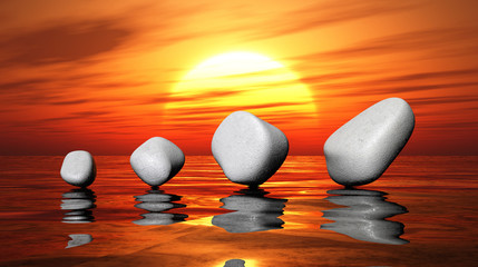 White stones on sunset water