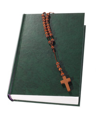 Fototapeta na wymiar Wooden rosary on the Bible