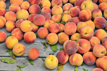 ripe peaches in crate