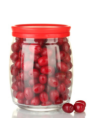 fresh cornel berries in glass jar isolated on white