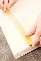 measuring wooden board close-up