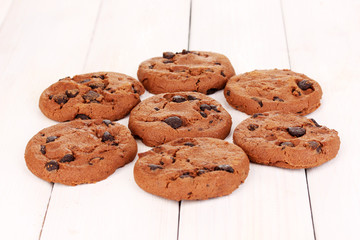 Chocolate chips cookie on wooden background
