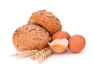 Bun with seeds and broken egg