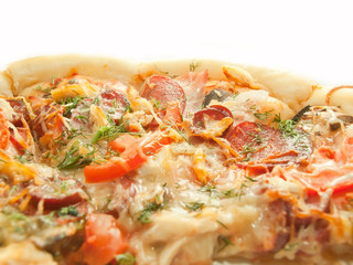 Pizza with tomato and salamy closeup isolated on white