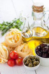 Mediterranean products. Pasta, tomatoes, capers and olives oil