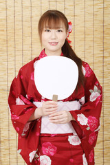 Young asian woman in clothes of kimono