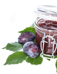 Glass with Plum Jam on white