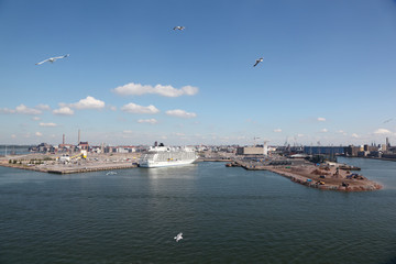 Panorama of sea port wih moored cruise ship.