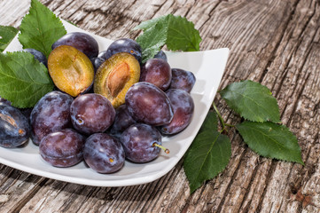 Heap of Plums in a bowl (side view)