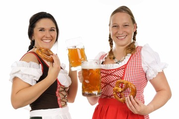 two pretty women in dirndls and pretzels