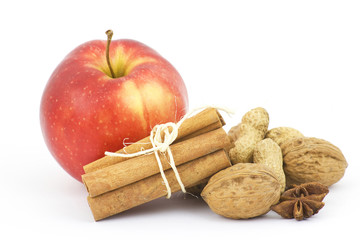 apple, cinnamon sticks and nuts