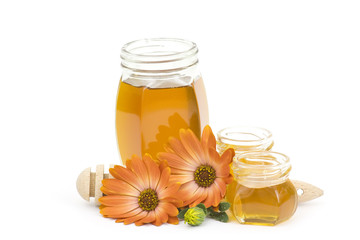 honey and flower on white