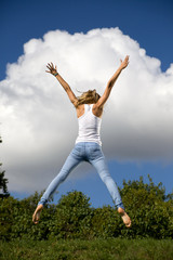 Young girl jumping in air