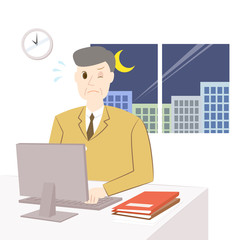 残業をする中年男性