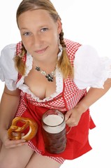 pretty women in dirndl with pretzels and pint