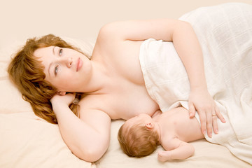 Fototapeta na wymiar Mother is breast feeding a newborn baby