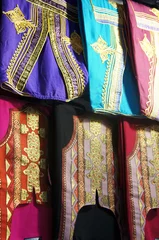 Fototapeten Tunisian colorful clothes hanging in a bazaar © etra_arte