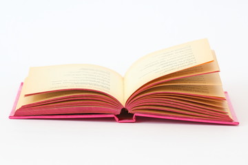 open pink book over white