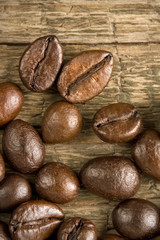 Coffee beans on the wooden vintage background