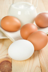 Jug with milk and eggs