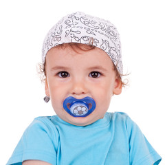 adorable little kid holding his pacifier