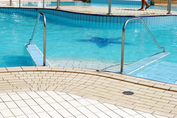 Fototapeta na wymiar swimming pool stainless steel ladder