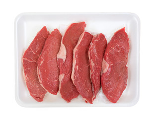 Steaks on white foam meat tray