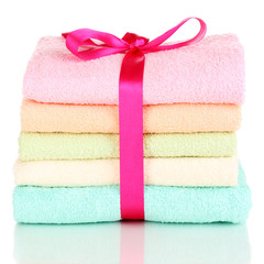 Obraz na płótnie Canvas Colorful towels with ribbon isolated on white