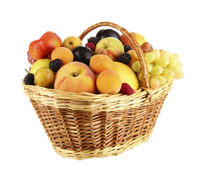 Still life of fruit in basket isolated on white
