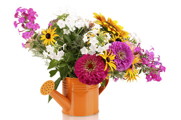 Beautiful bouquet of bright flowers in bailer isolated on white