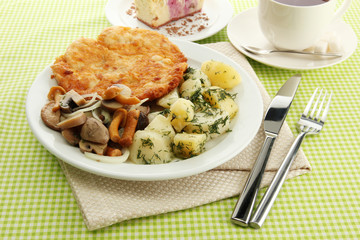 Roast chicken cutlet with boiled potatoes and  vegetables, cup