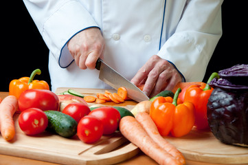 Chef chopping vegetables, horizontal shot