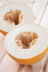 Vertical shot of a fresh melon cut in two halves