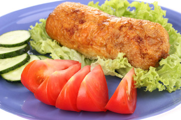 Tasty meat cutlet with garnish on plate close-up
