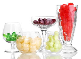 Color candies in glasses isolated on white