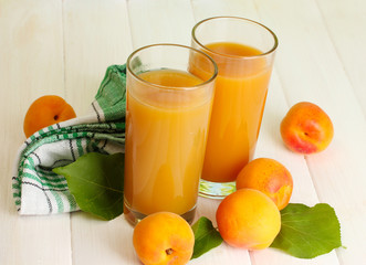 glasses of apricot juice  and fresh apricots