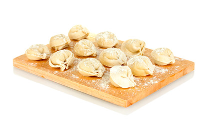 Raw Dumplings on cutting board isolated on white
