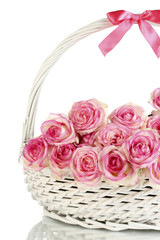 Fototapeta na wymiar beautiful bouquet of pink roses in basket, isolated on white