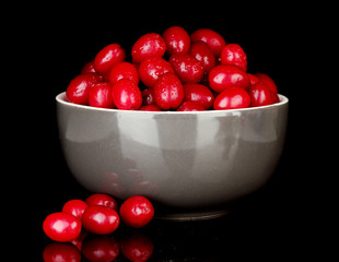 fresh cornel berries in bowl isolated on white