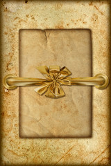 grungy card with golden ribbon