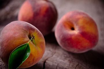 Fototapeta na wymiar Fresh peaches on wooden table