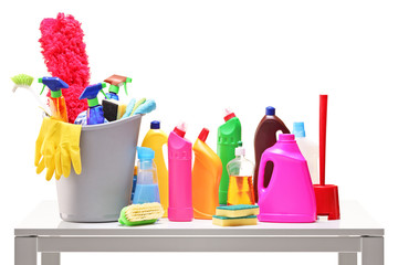 Bucket and cleaning supplies on a table