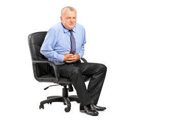 Businessman having a stomach ache