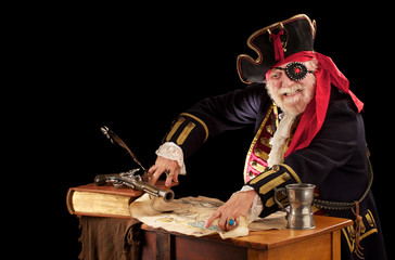 Happy old pirate captain pointing at his treasure map