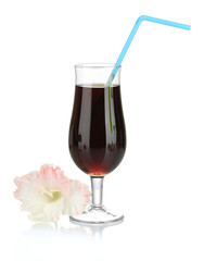 glass with cocktail and gladiolus bud isolated on white