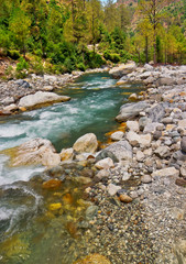 mountain river bed with deposited boulders