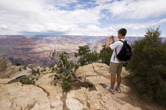 Boy taking picture at Grand Canyon