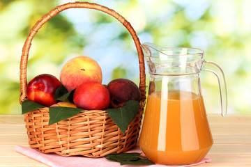 Ripe peaches in basket and juice